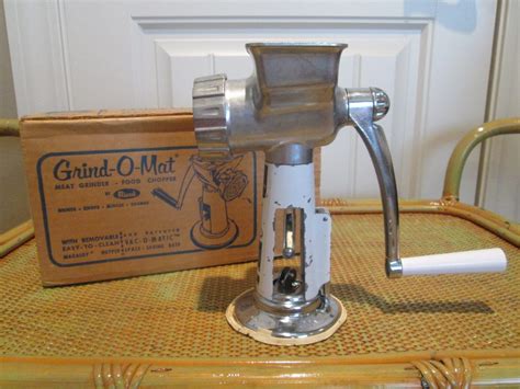 A look back in time at at vintage meat grinder food chopper by Rival The Grind-O-Mat Model 303. . Grind o mat